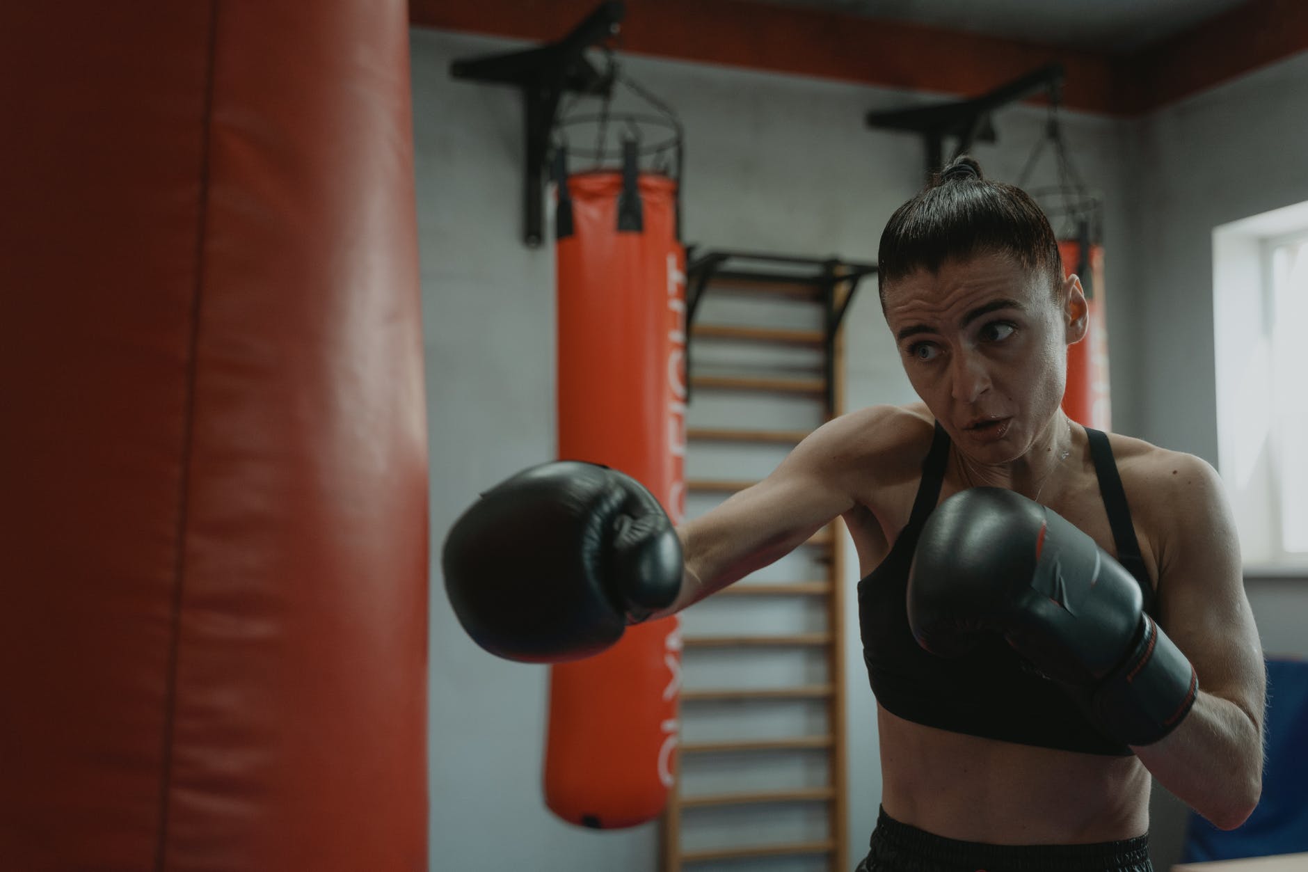 woman hitting a punching bag