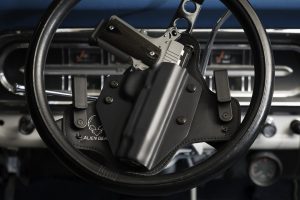 handgun in holster steering wheel