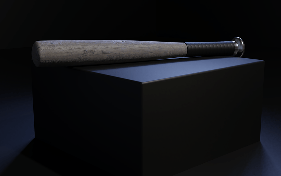 a wooden baseball bat on a box