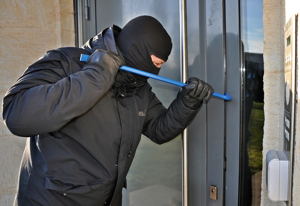 burglar breaking into a home