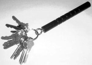 An original Kubotan keychain with keys attached