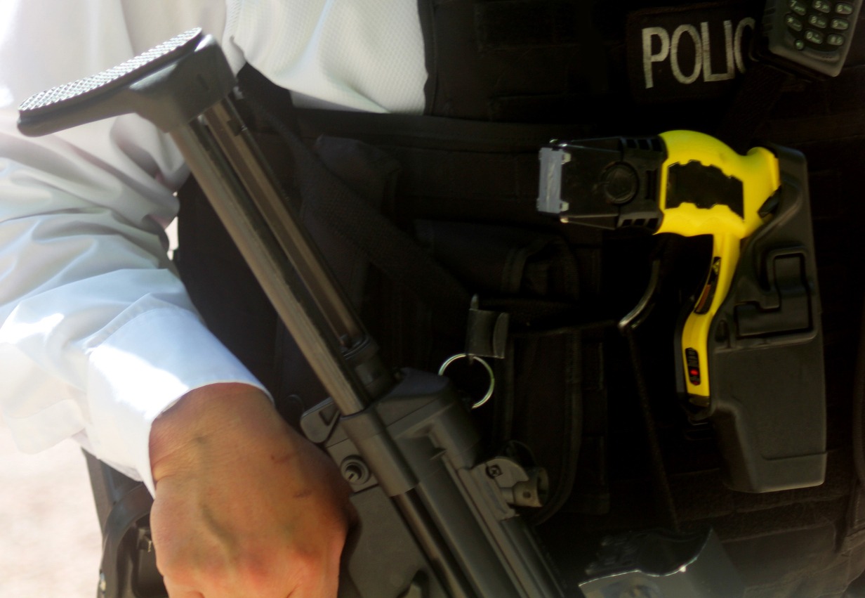 armed police equipped with taser