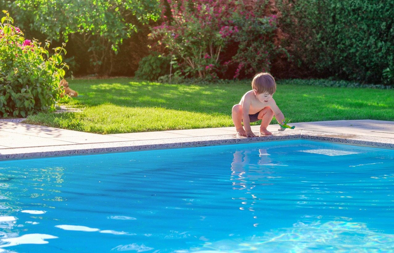 child playing by the pool